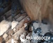 ru pov. Russian found what they say is a torture chamber near Kherson. A corpse is visible in Russian clothes and alleged torture marks, also visible, used syringes and javelin casings. from visible